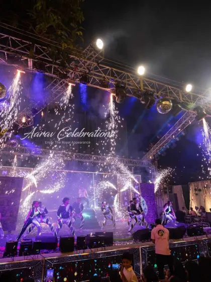 A spectacular sangeet stage with pyrotechnics raining down like a waterfall. This kind of grand effect creates a stunning visual and an unforgettable finale for any performance.