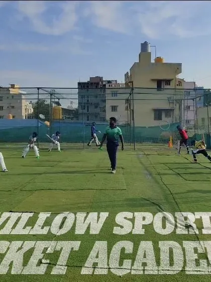A wide shot of a training session in progress. Our grounds are designed to accommodate multiple drills simultaneously, from batting and bowling to fielding practice.