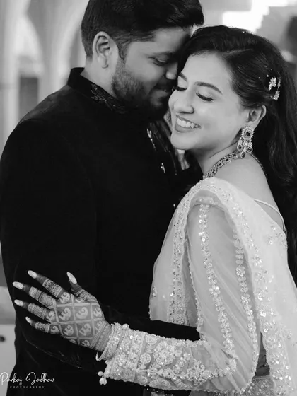 A beautiful black and white close-up of Swati's joyful smile during her engagement celebration.