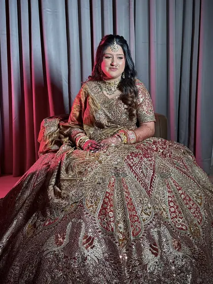 An artistic shot with dramatic lighting, giving the bride a regal and majestic look.