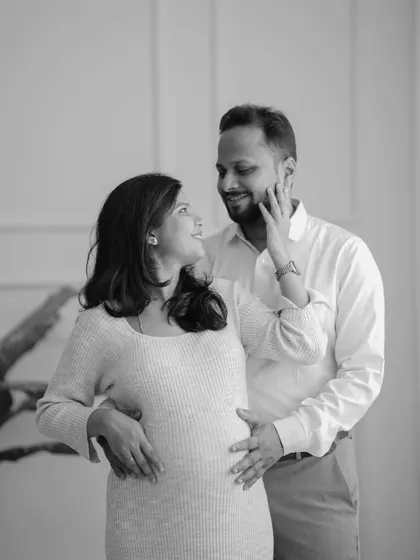 A joyful and intimate couple's portrait in black and white. Their loving expressions and gentle touch are the complete focus of this beautiful image.