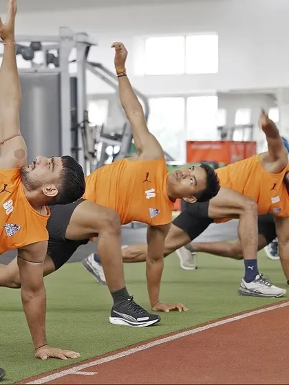 A synchronized mobility drill. The entire team moving as one, focusing on thoracic rotation to improve flexibility and prevent injuries.