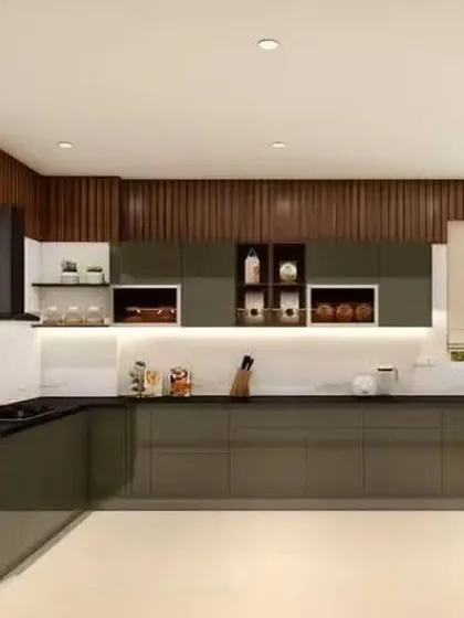 A sophisticated L-shaped kitchen featuring dark, glossy cabinets and a contrasting white countertop. The back wall is accented with vertical wood paneling, adding texture and warmth to the modern design.