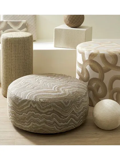 The 'Celestial Weaving' collection features beautifully crafted jacquards and bespoke patterns. I use these fabrics to upholster ottomans and seating, creating an understated yet luxurious space with a focus on texture.
