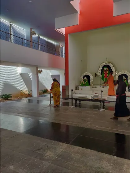 The interior of the Sai Temple prayer hall, with the main deities in the sanctum. The space is designed to be simple and calm, allowing for personal reflection.