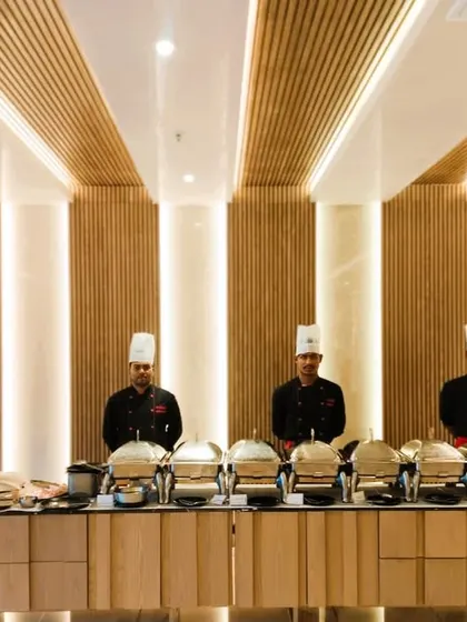 We pride ourselves on elegant and professional buffet presentations. Here is a full dinner setup at Prestige Primrose Hills, showcasing our clean, organized catering line ready for service in a modern clubhouse setting.