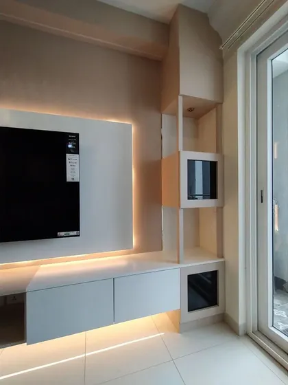 A detail shot of the side shelving unit, which includes both open shelves and glass-fronted cubes for versatile display options.