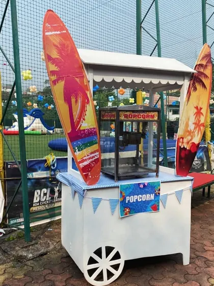 No party is complete without snacks. A surf-themed popcorn cart is the perfect addition to a pool party.