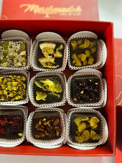 A closer look at my guilt-free chocolate bites. I use pure couverture chocolate and top it with a variety of nuts, seeds, and exotic dried fruits like apricots and cranberries. There is no added sugar, just pure, natural flavour.
