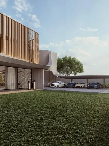 The backyard of the Celestia residence is designed with a vast, open lawn, perfect for family activities. The home's modern facade, with its curved lines and wooden louvers, provides a beautiful backdrop.