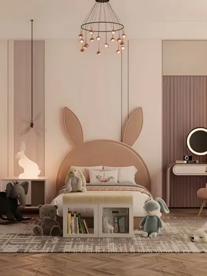 A dreamy and soft-themed kid's room with a bunny-shaped headboard as the centerpiece. The design uses a gentle pink and beige color palette, along with whimsical lighting, to create a magical and serene space.