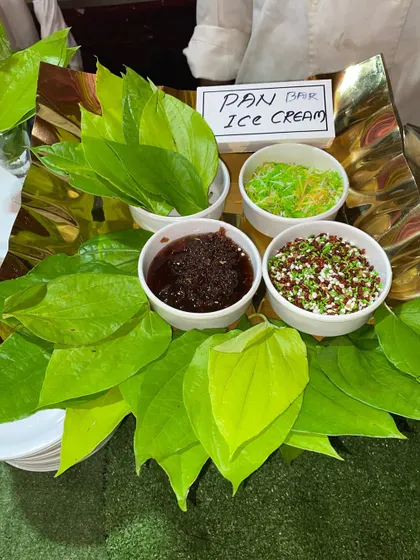 The complete setup for our Paan Ice Cream station, with fresh paan leaves and various sweet fillings.