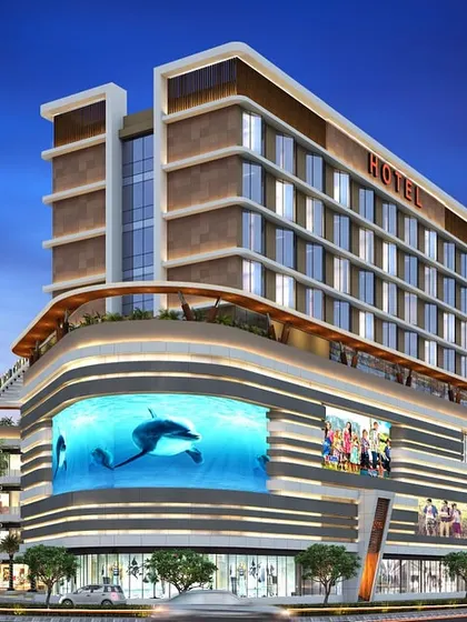 A render of a mixed-use hotel and retail project, showcasing its prominent corner location and modern design.