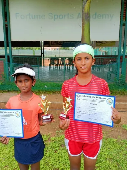 The Girls U10 winner and runner-up with their awards. We create a positive and encouraging environment for our youngest competitors.