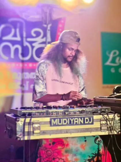 A focused shot of me at my DJ setup during a festival.
