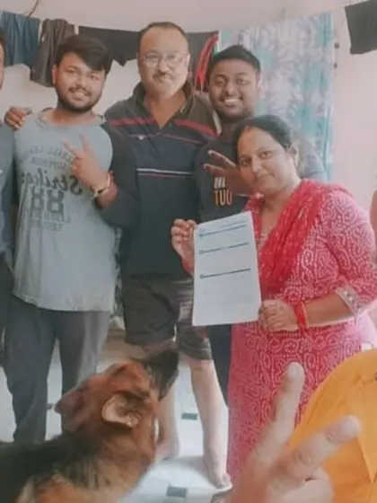 A family, including their German Shepherd, celebrates their decision to go solar with our team. It's a choice the whole family, even the furry members, can be happy about.