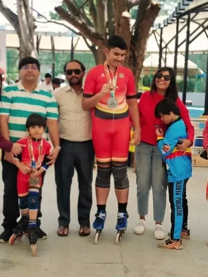 Our national medalists, Shubham and Rayaansh, celebrating their victory with their supportive families and coaches.