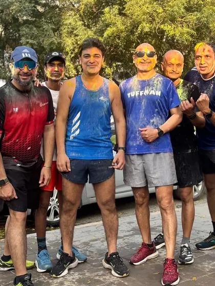 The men of the tribe, covered in Holi colors after a tough workout. We train hard and celebrate with equal passion.