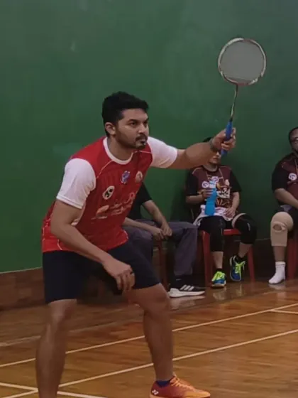 A player focused and ready to smash the shuttlecock during the Inter Parish BCS event.