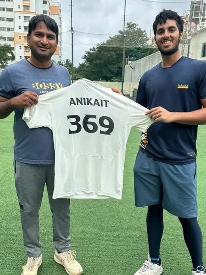 A player proudly displays his jersey with his chosen number. These small touches help build a professional and aspirational team environment.