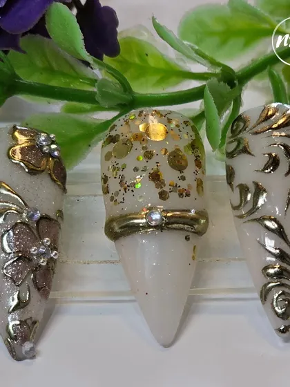 An incredibly detailed and luxurious set by a student. They've used embossed chrome, glitter, and gems to create a truly royal look.