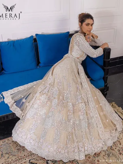 This elegant lehenga with its soft hues and bold details is a perfect ensemble for the bride who embodies timeless grace.