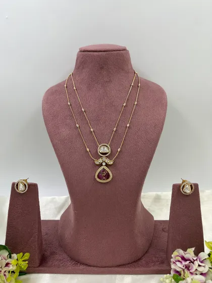 The Myra Crystal Bloom Necklace. This is another lightweight, double-chain design with crystal pendants, perfect for modern and minimalist tastes. Available in red and green.