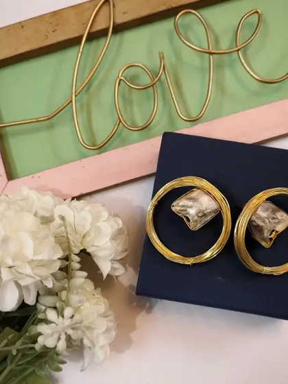 Another lovely shot of the beautiful golden brass hoop earrings, ready to be gifted.