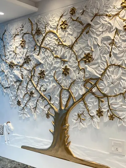 A detailed shot of the finished Kalpavriksh, highlighting the texture of the leaves and the metallic sheen of the golden branches and flowers.