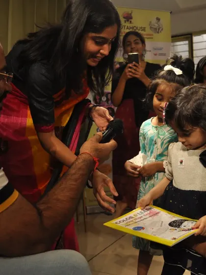 A special moment as a musician presents our book to one of the youngest attendees. We aim to create a welcoming environment for even the tiniest tots.