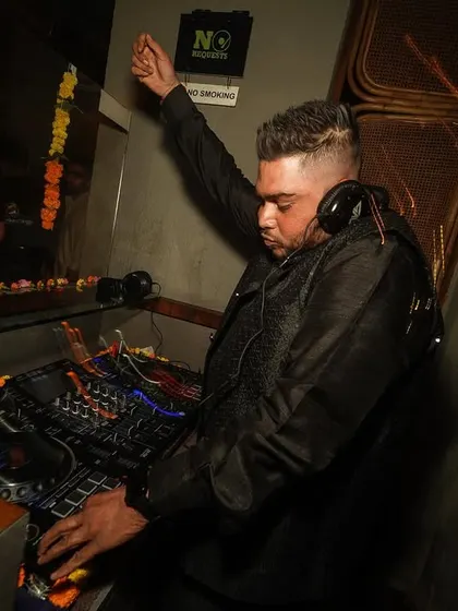 Raising the energy during a Diwali set. The gear is decorated with marigolds, blending tradition with modern beats.