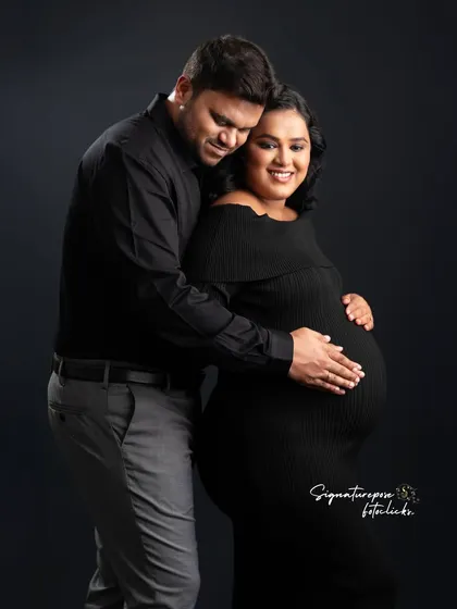 A sweet and simple couple's portrait in classic black, capturing a moment of quiet connection and love.