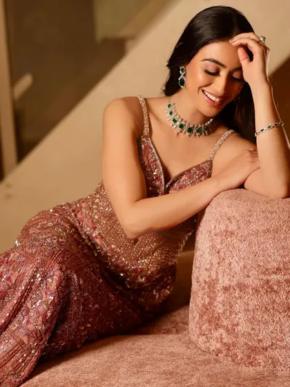 A candid, smiling shot that shows how the makeup looks natural and beautiful even in relaxed moments. The glow is real and the smile is genuine.