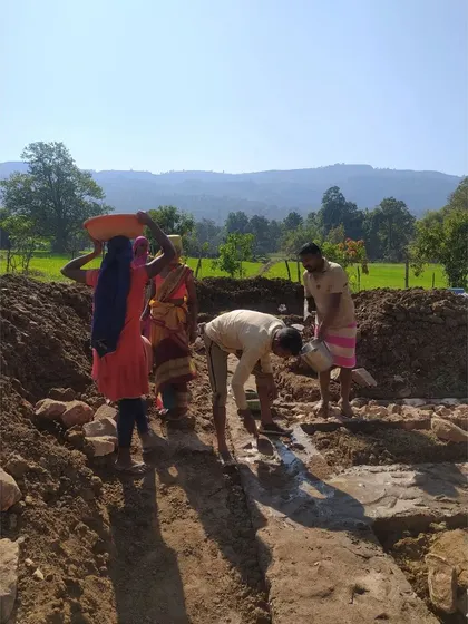 Community members work together to prepare the foundation, moving earth and stone by hand. This collective effort fosters a deep sense of ownership and pride in the project, creating spaces that truly belong to the people.