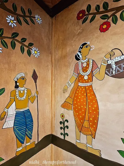 The mural wraps around corners seamlessly, continuing the story of the procession. Here, figures are painted to interact with the architecture of the space itself.
