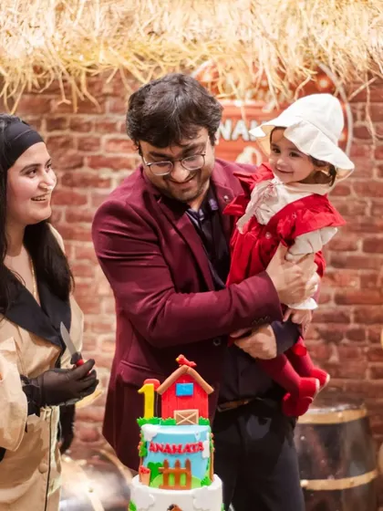 A happy family moment from the barnyard party that we managed to set up despite the rain. Their smiles make all the stress disappear.