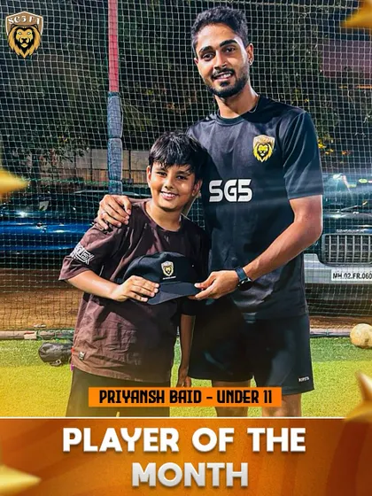 Priyansh Baid, an Under 11 Player of the Month, being congratulated by his coach.
