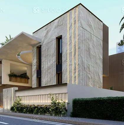The street-facing view of our Coimbatore project, featuring a massive stone-clad wall with integrated vertical lighting. This element provides a sense of privacy and grandeur.