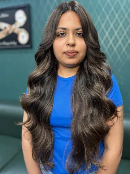 A frontal view of the versatile caramel brown color. The soft layers frame the face beautifully, creating a sophisticated and polished appearance.