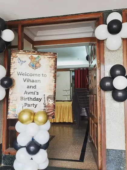 A warm welcome to Vihaan and Avni's birthday party with a custom Harry Potter themed entrance. The decor, featuring balloon clusters and a personalized welcome sign, sets the magical tone right from the start.