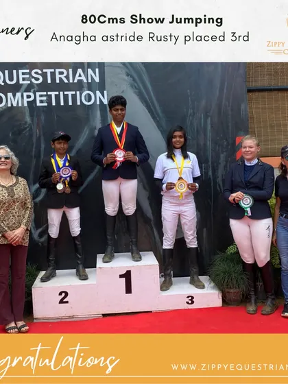 Anagha and Rusty on the podium after placing third in the 80cms show jumping event. Consistent performance is key to competitive success.