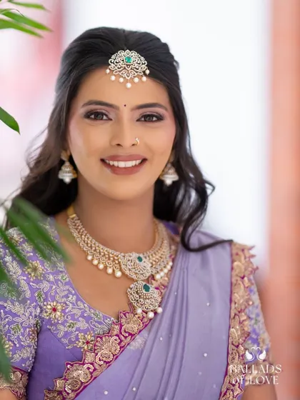 A lovely portrait of the bride, looking directly at the camera with a warm smile.
