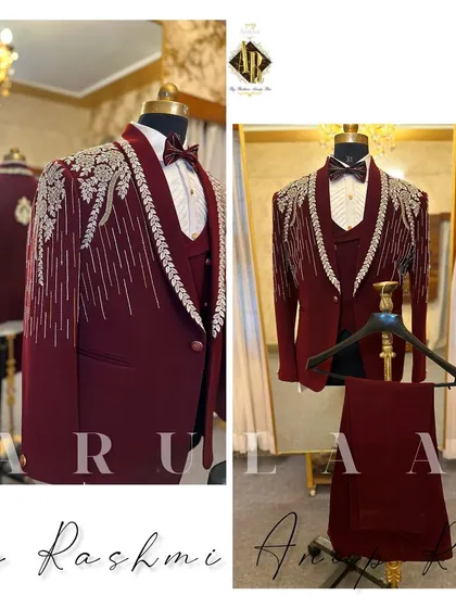 Another angle of the magnificent maroon tuxedo, showcasing the complete three-piece set. The matching bow tie and waistcoat complete this ultimate groom's reception outfit.