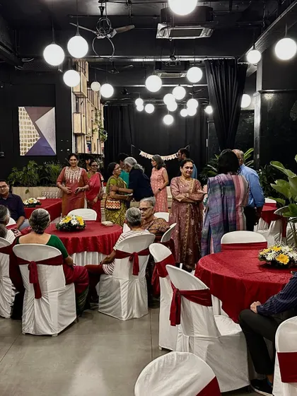 Guests mingling at a corporate or family gathering, showcasing the indoor dining and social space we offer.