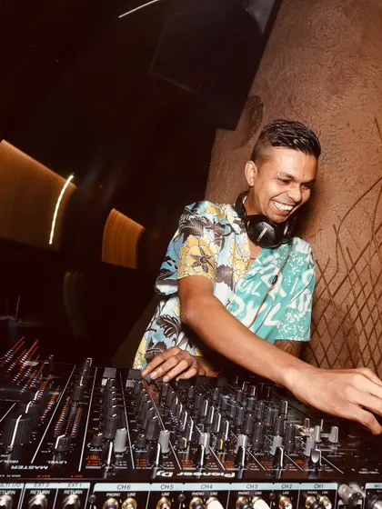 A motion-blur shot that captures the dynamic energy of a live DJ set. The focus is on my smile and the fun I'm having.