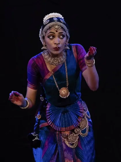 A playful and curious expression, portraying a Gopika caught in a moment of surprise. Abhinaya is about bringing these characters and their stories to life.