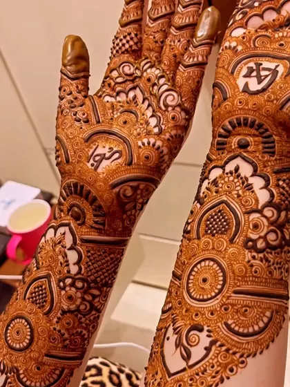 This design for bride Gulshan features her and her partner's initials hidden within the intricate patterns. It's a subtle and personal touch that makes the mehendi extra special.