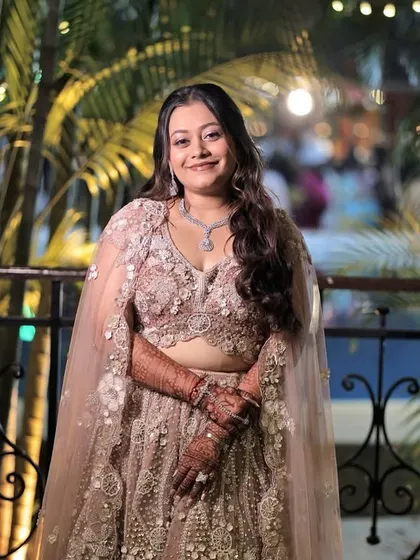 The full sangeet look. Nehal's pastel lehenga with a cape is perfectly complemented by the soft and glamorous makeup, making her look like a modern princess.