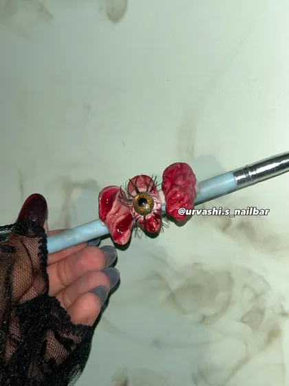 For those who love spooky season, this 3D horror set is a showstopper. I sculpted a realistic eyeball with lashes, brains, and bloody textures to create a truly unique and creepy Halloween look.