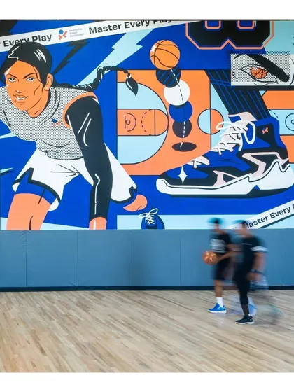 The mural wall provides an inspiring backdrop for every training session, reminding players to "Master Every Play."
